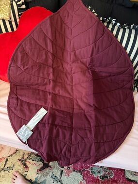 kate quinn burgundy leaf-shaped quilted playmat